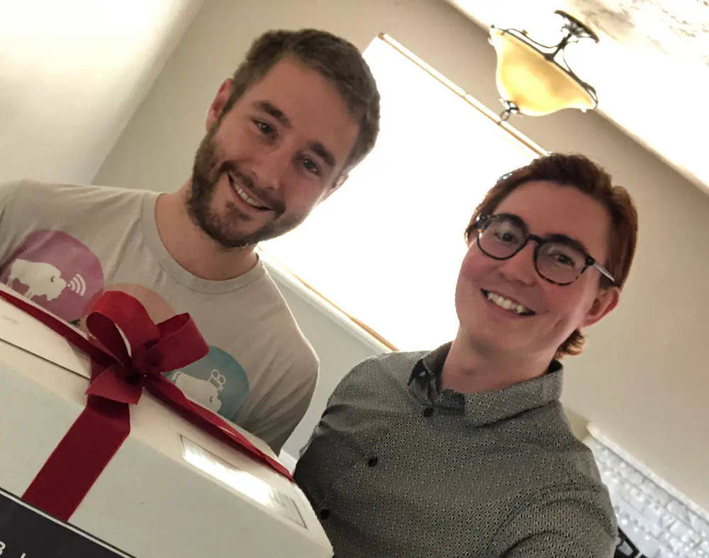 Buyer celebrating in the living room of his first home on the Boise Bench, an updated single-level residence on a quiet street.