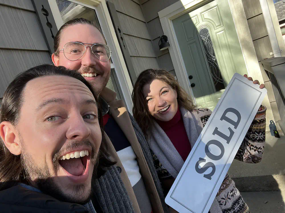 Buyers celebrating the purchase of their first home in Southeast Boise on an oversized lot.