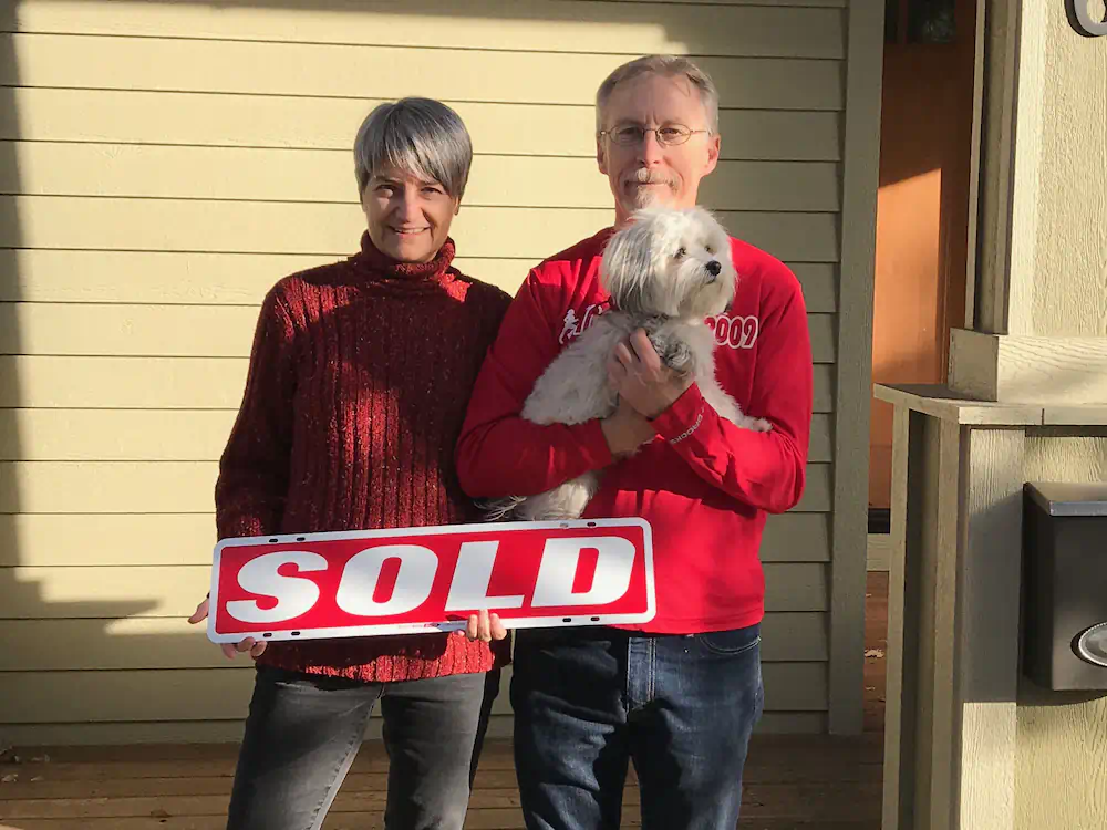 Happy clients who bought a lovely home in Southeast Boise with their cute puppy.